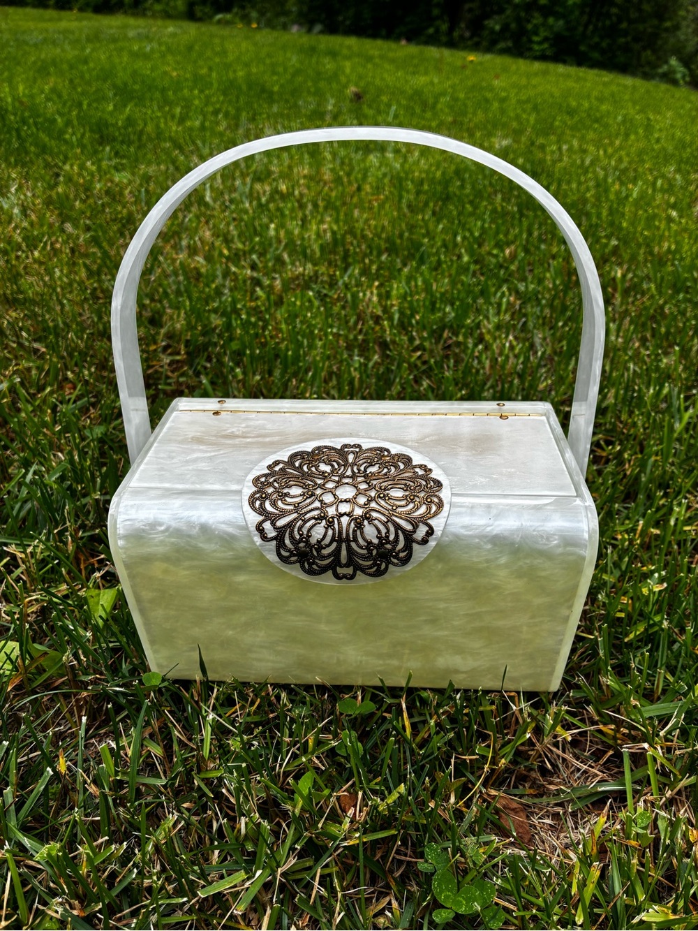 Pearlescent White Mini Top-Handle Bag with Decorative Medallion